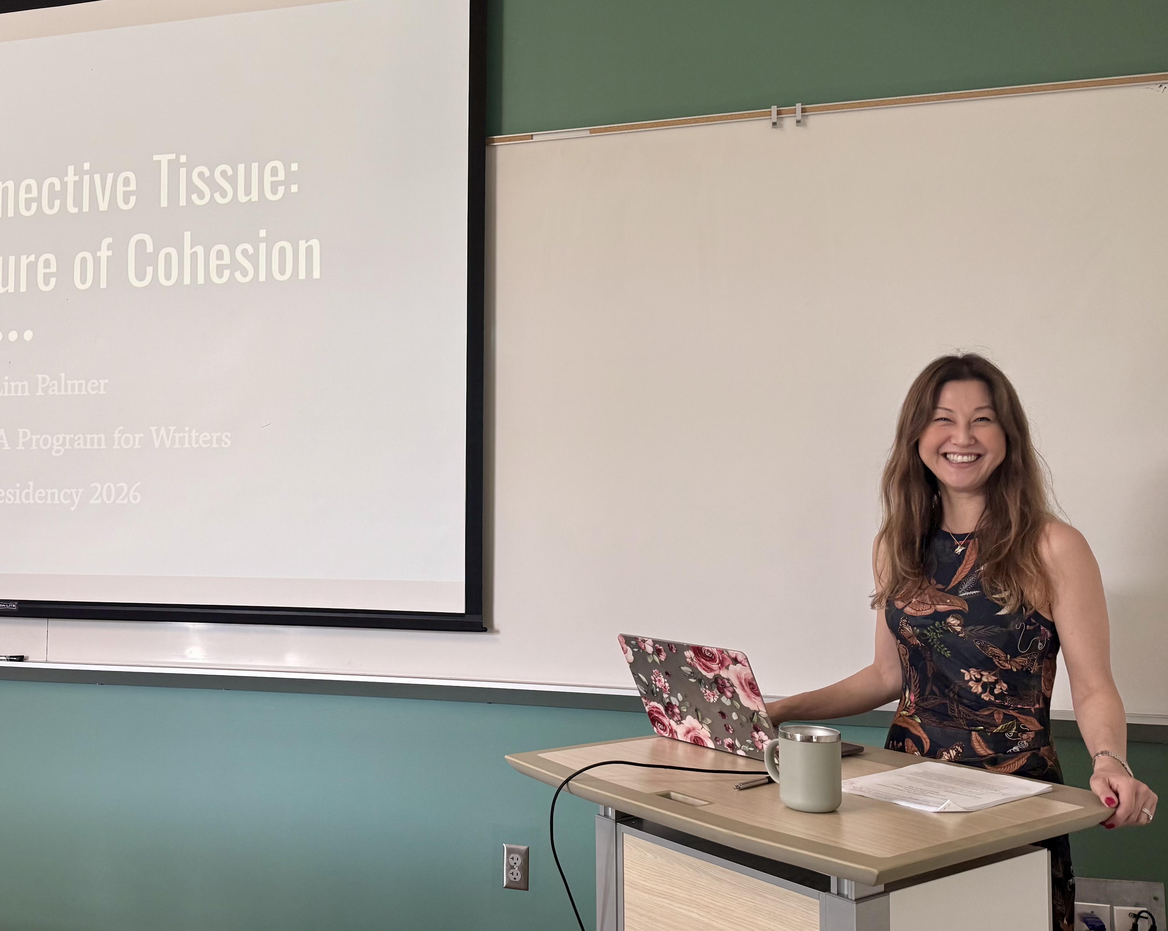Poetry presentation beside a projection screen
