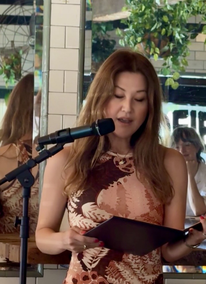 Poetry reading at a microphone